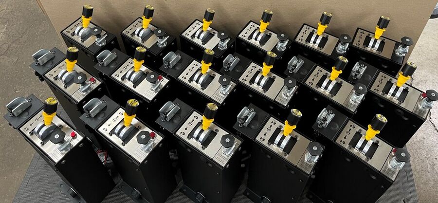 A row of finished DEL control consoles